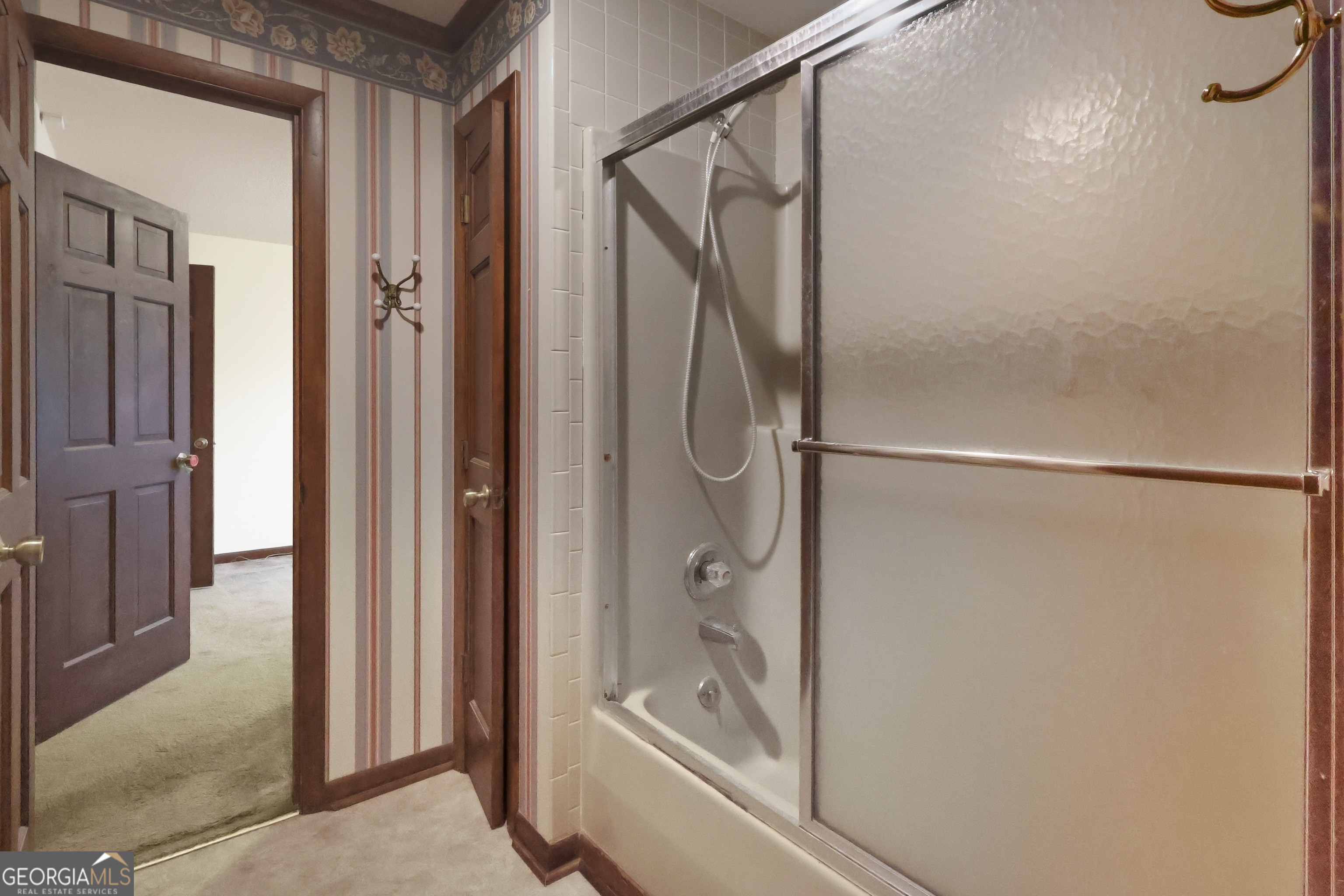 41 Brooks Street Royston, GA 30662 - Photo 17 of 44 a bathroom with a glass shower door