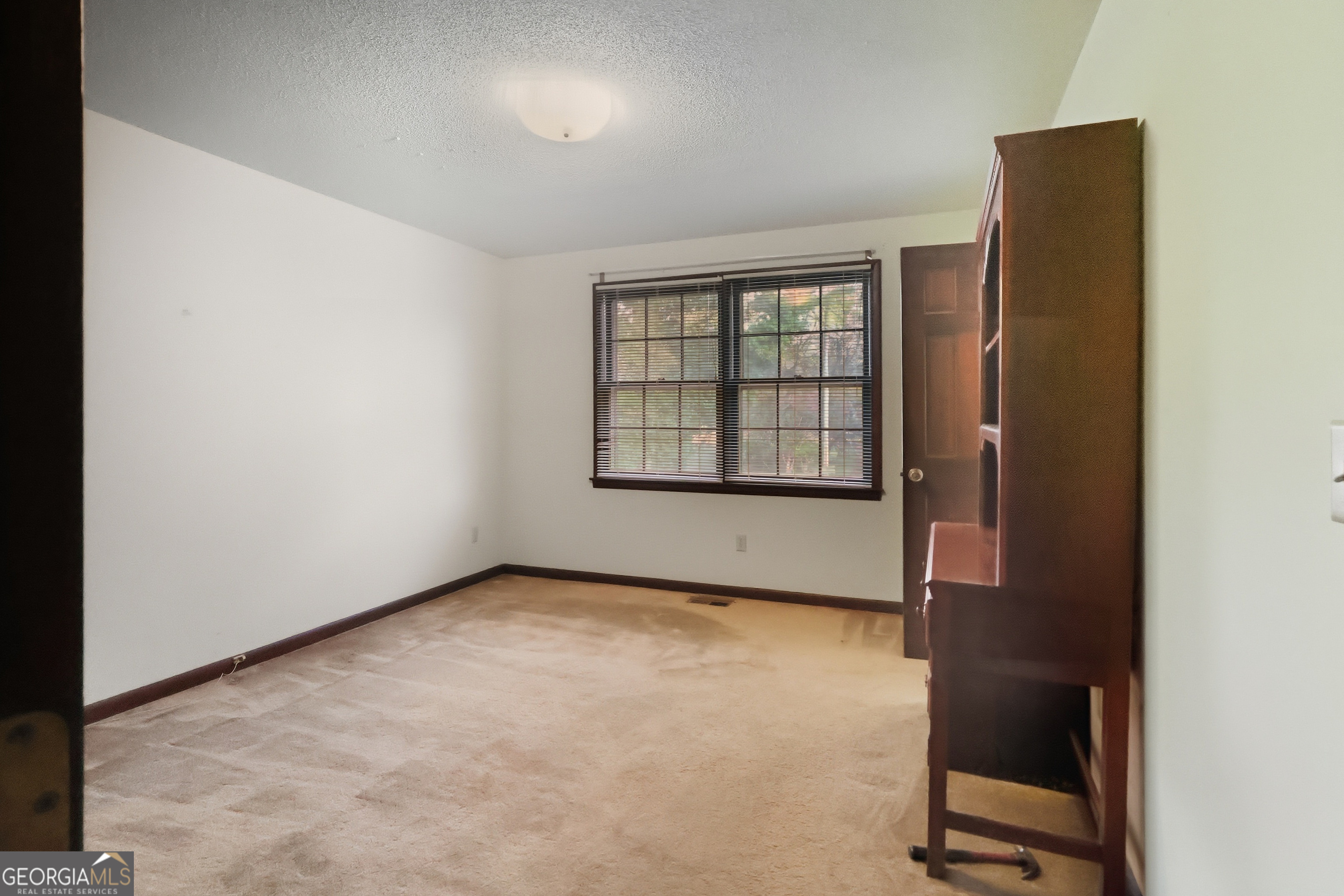41 Brooks Street Royston, GA 30662 - Photo 18 of 44 an empty room with windows
