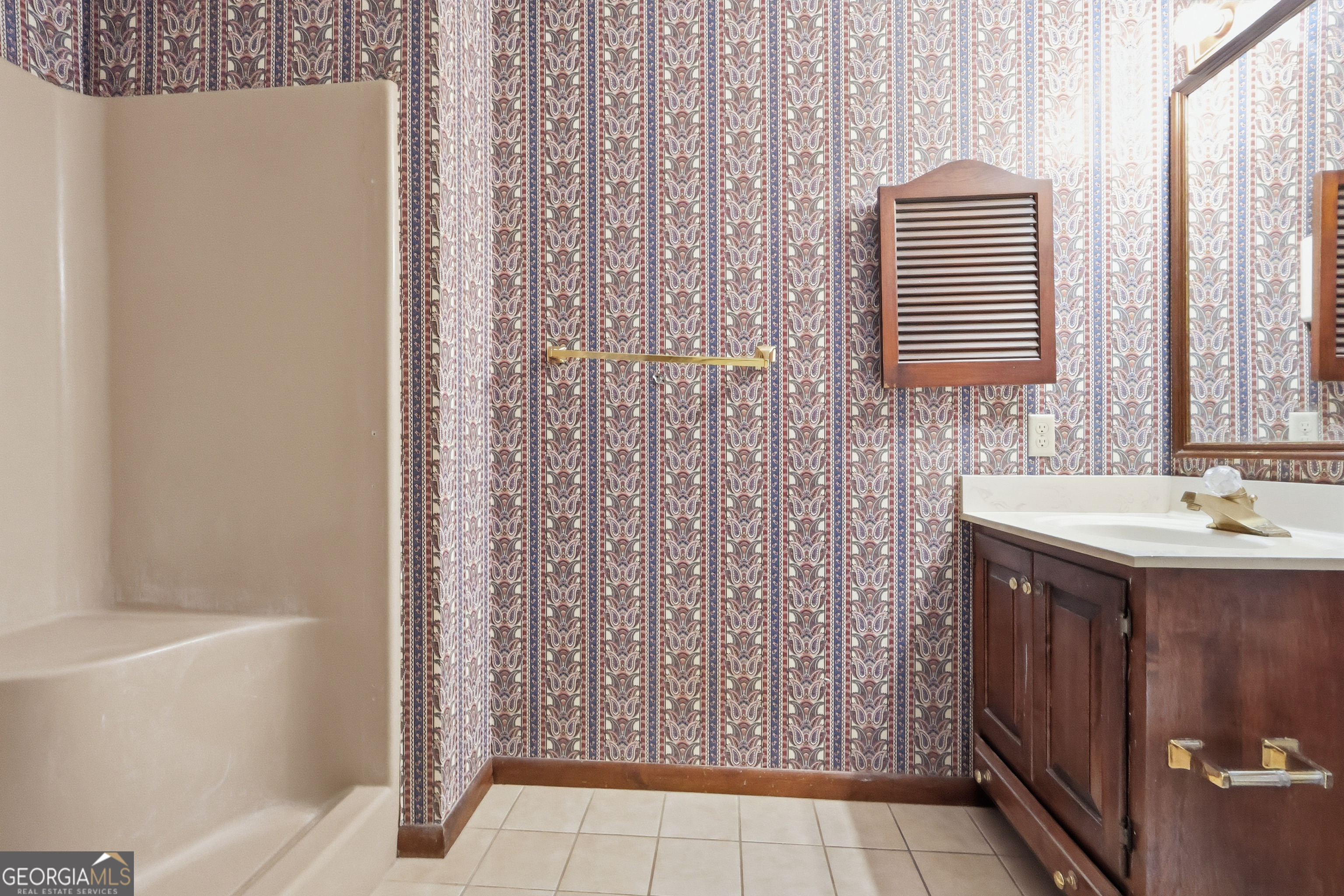 41 Brooks Street Royston, GA 30662 - Photo 21 of 44 a bathroom with a sink and a bathtub