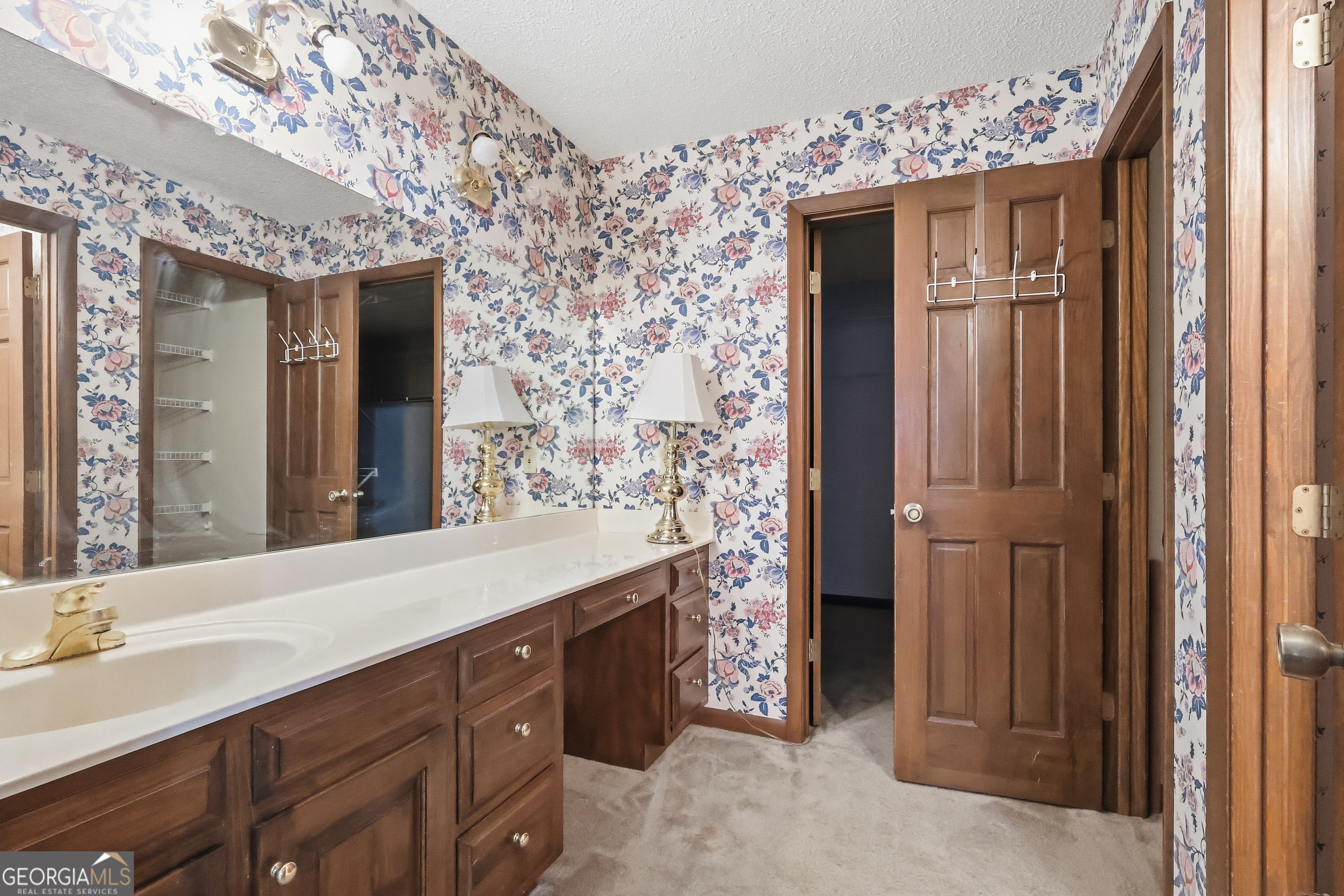 41 Brooks Street Royston, GA 30662 - Photo 25 of 44 a spacious bathroom with a double vanity sink and a mirror