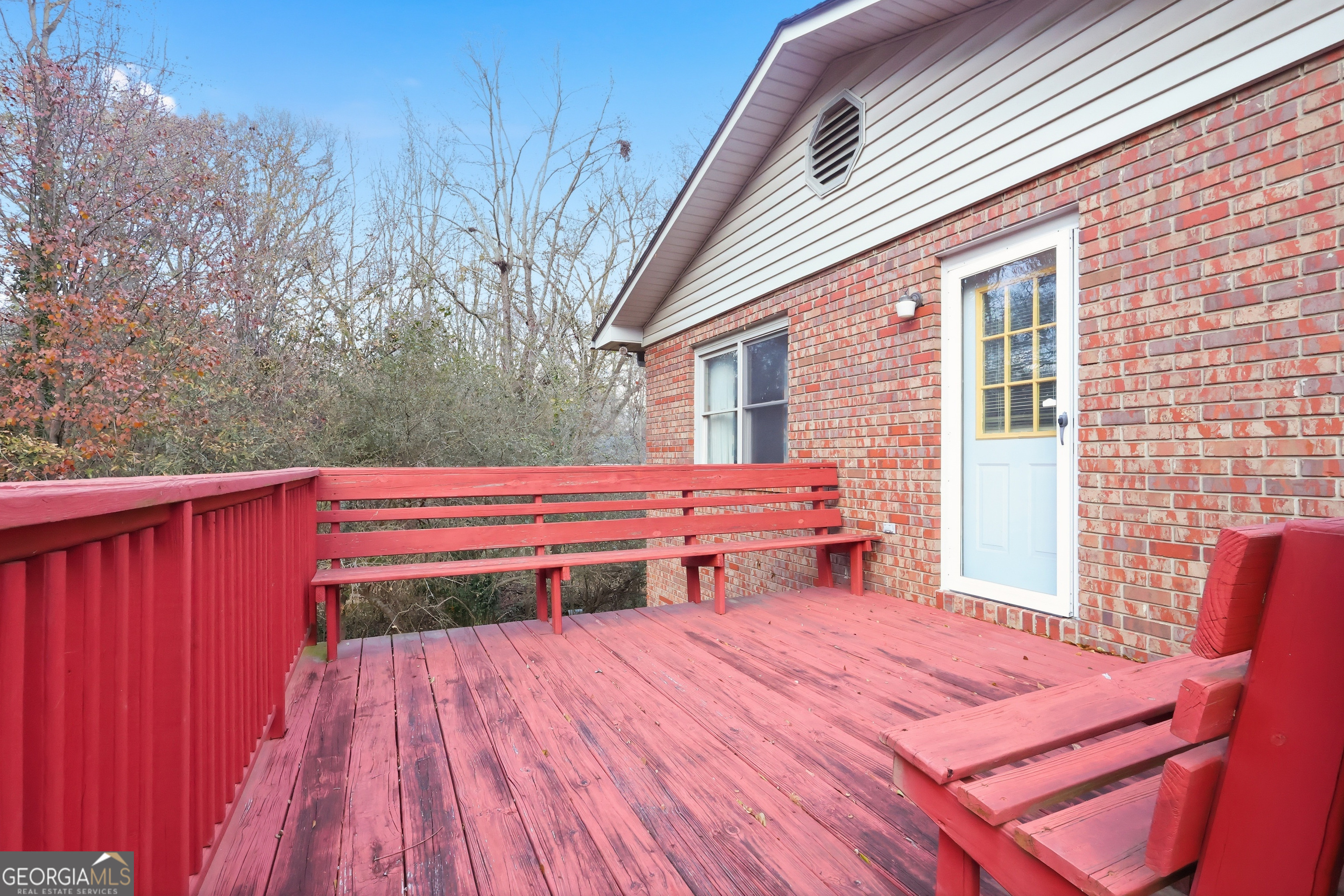 41 Brooks Street Royston, GA 30662 - Photo 29 of 44 a backyard of a house with wooden floor and wooden fence