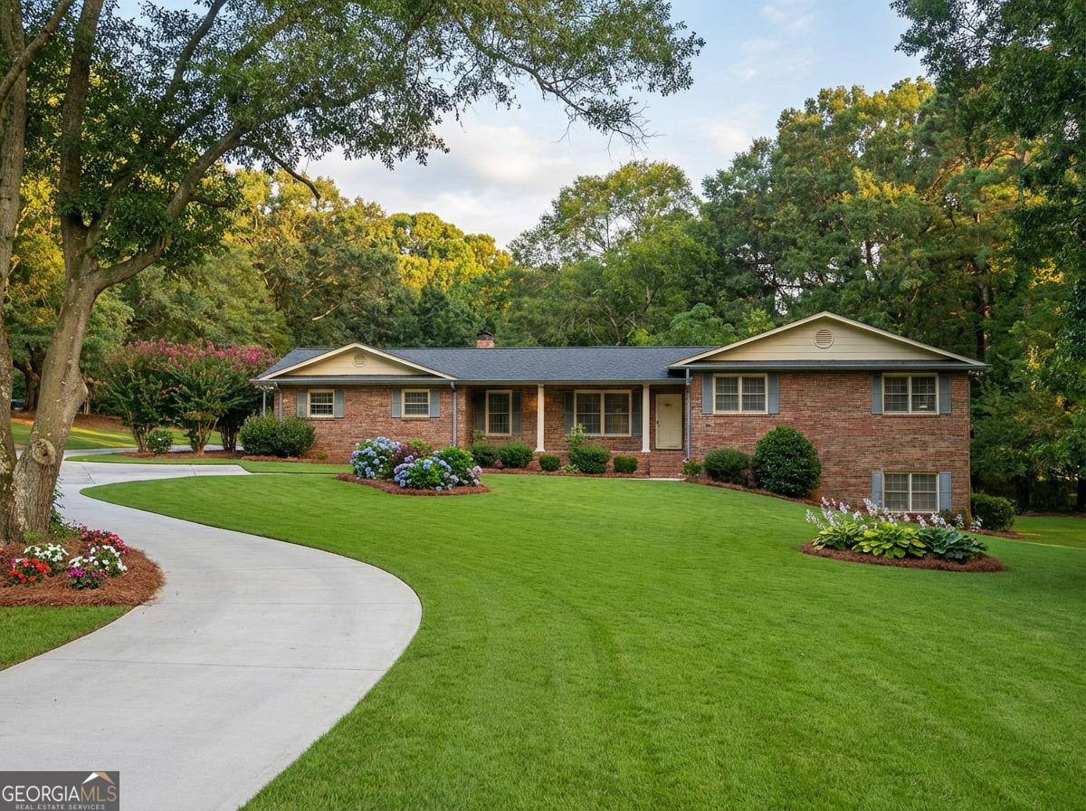 41 Brooks Street Royston, GA 30662 - Photo 3 of 44 a front view of a house with a yard and trees