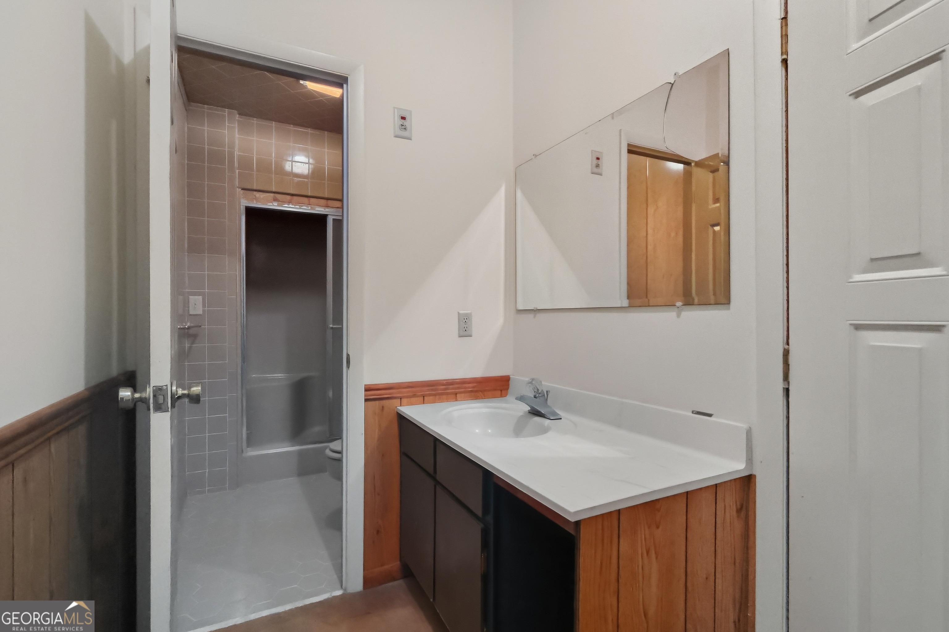 41 Brooks Street Royston, GA 30662 - Photo 32 of 44 a bathroom with a sink and a mirror