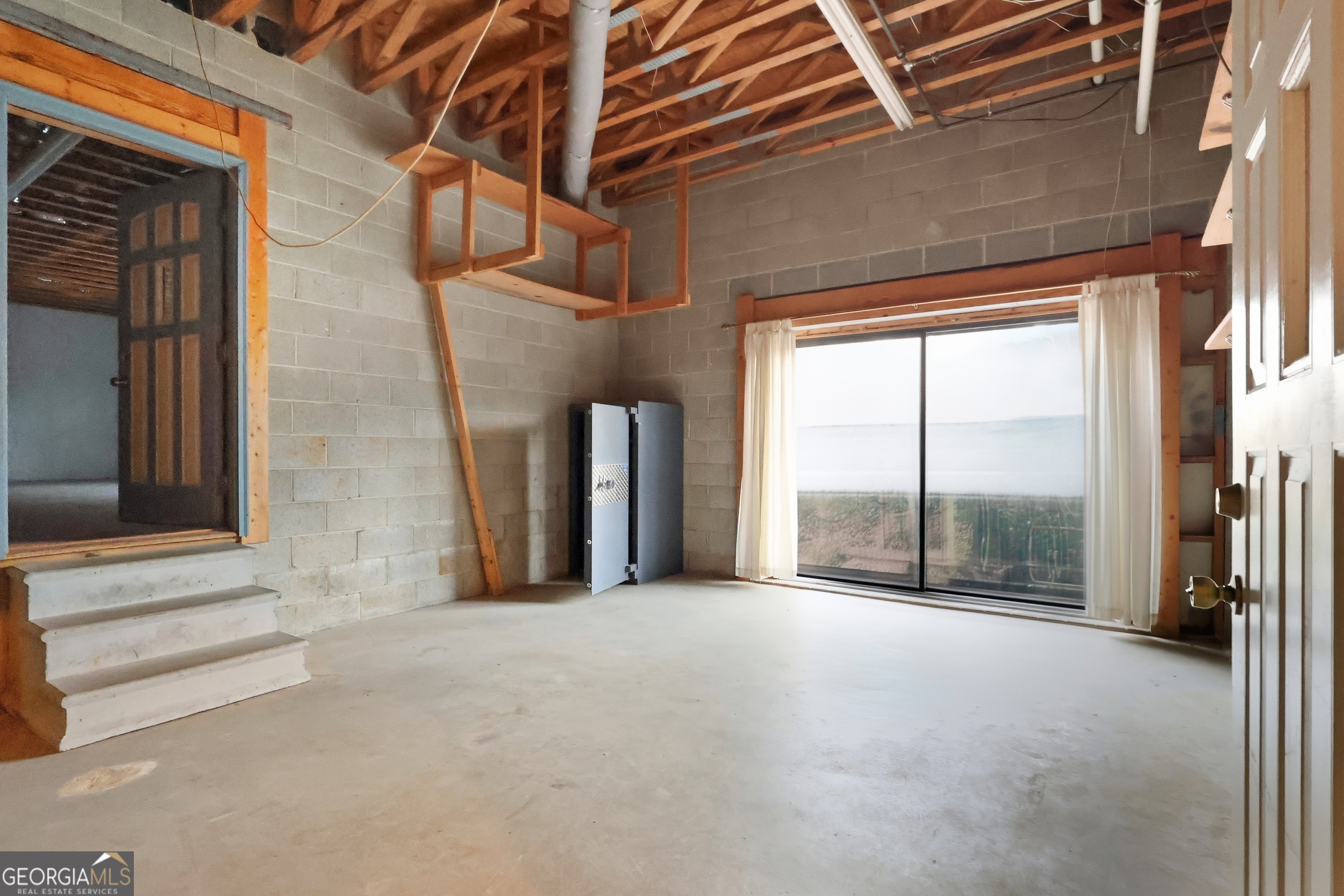 41 Brooks Street Royston, GA 30662 - Photo 34 of 44 a view of a building with an empty space and wooden door