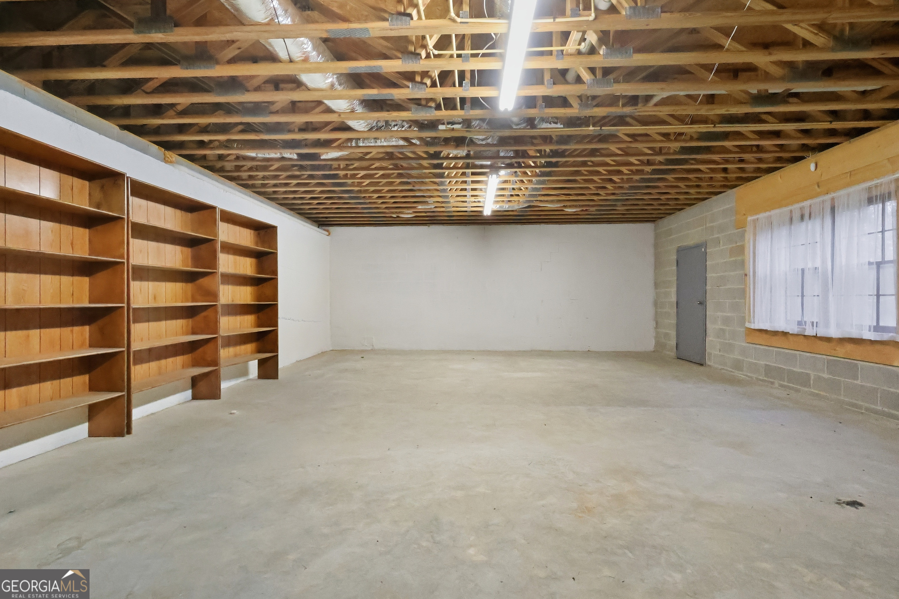 41 Brooks Street Royston, GA 30662 - Photo 36 of 44 a view of an empty room with shelves