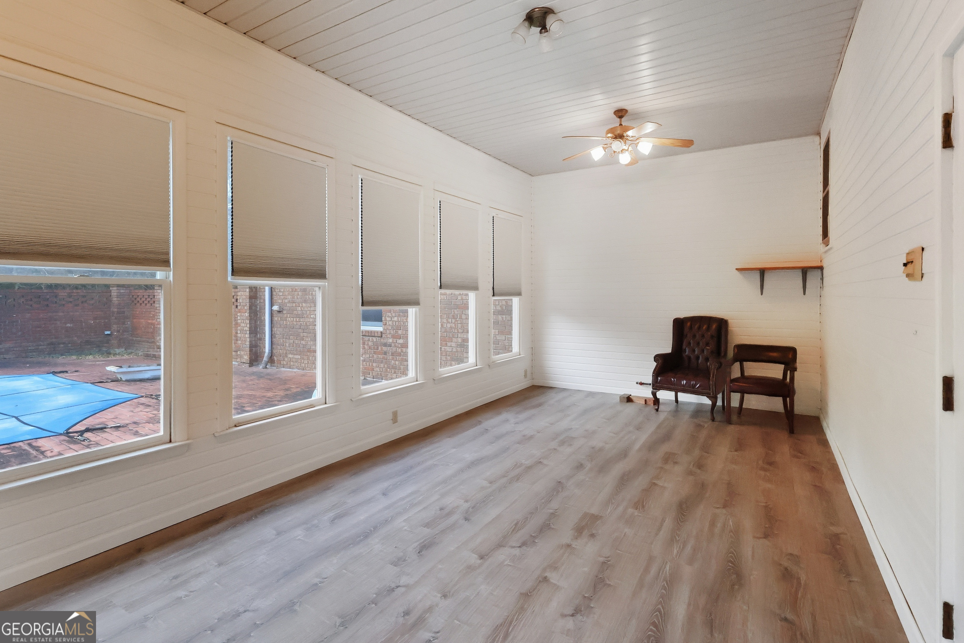 41 Brooks Street Royston, GA 30662 - Photo 37 of 44 a living room with furniture and a chandelier