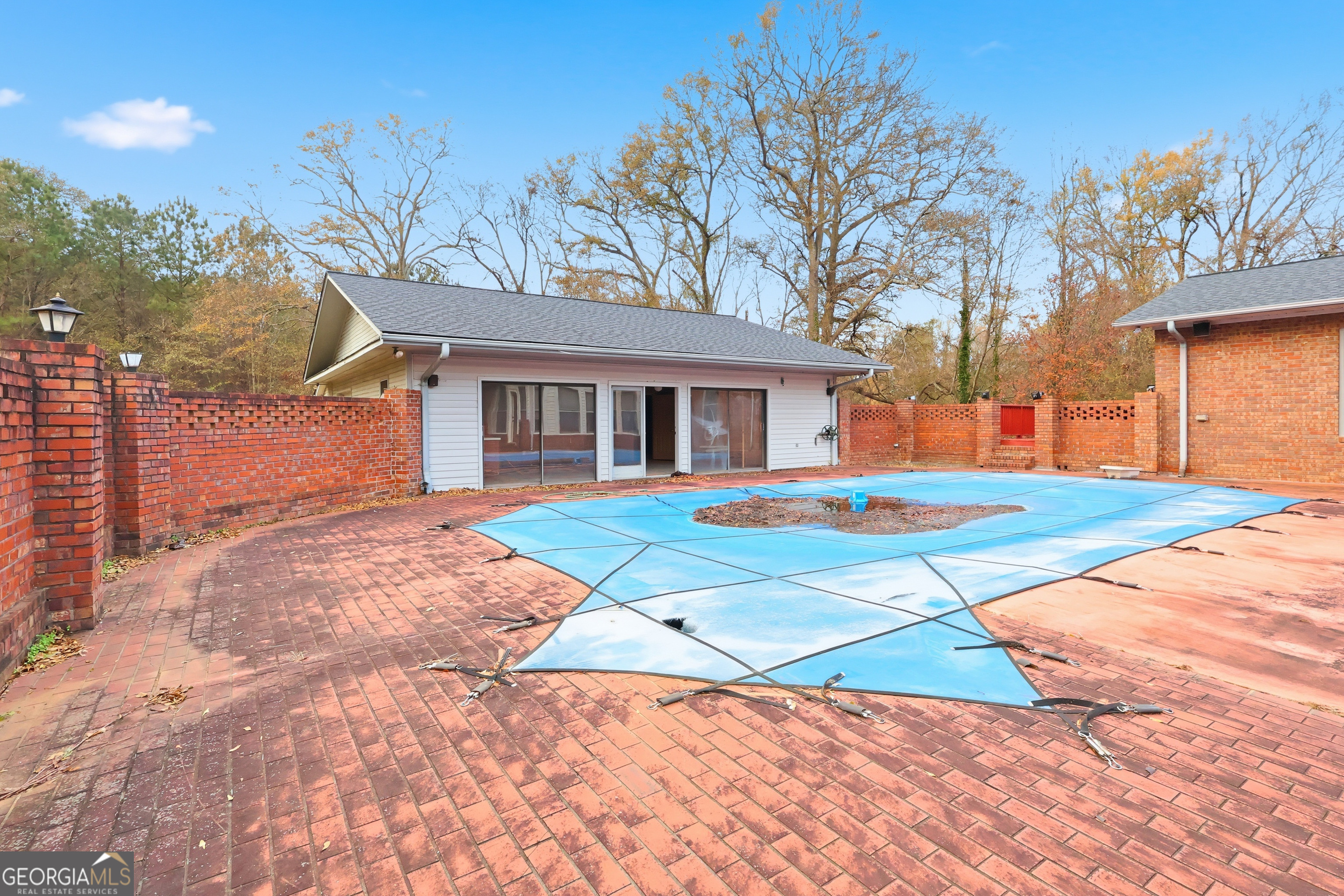 41 Brooks Street Royston, GA 30662 - Photo 40 of 44 a backyard of a house with barbeque oven table and chairs