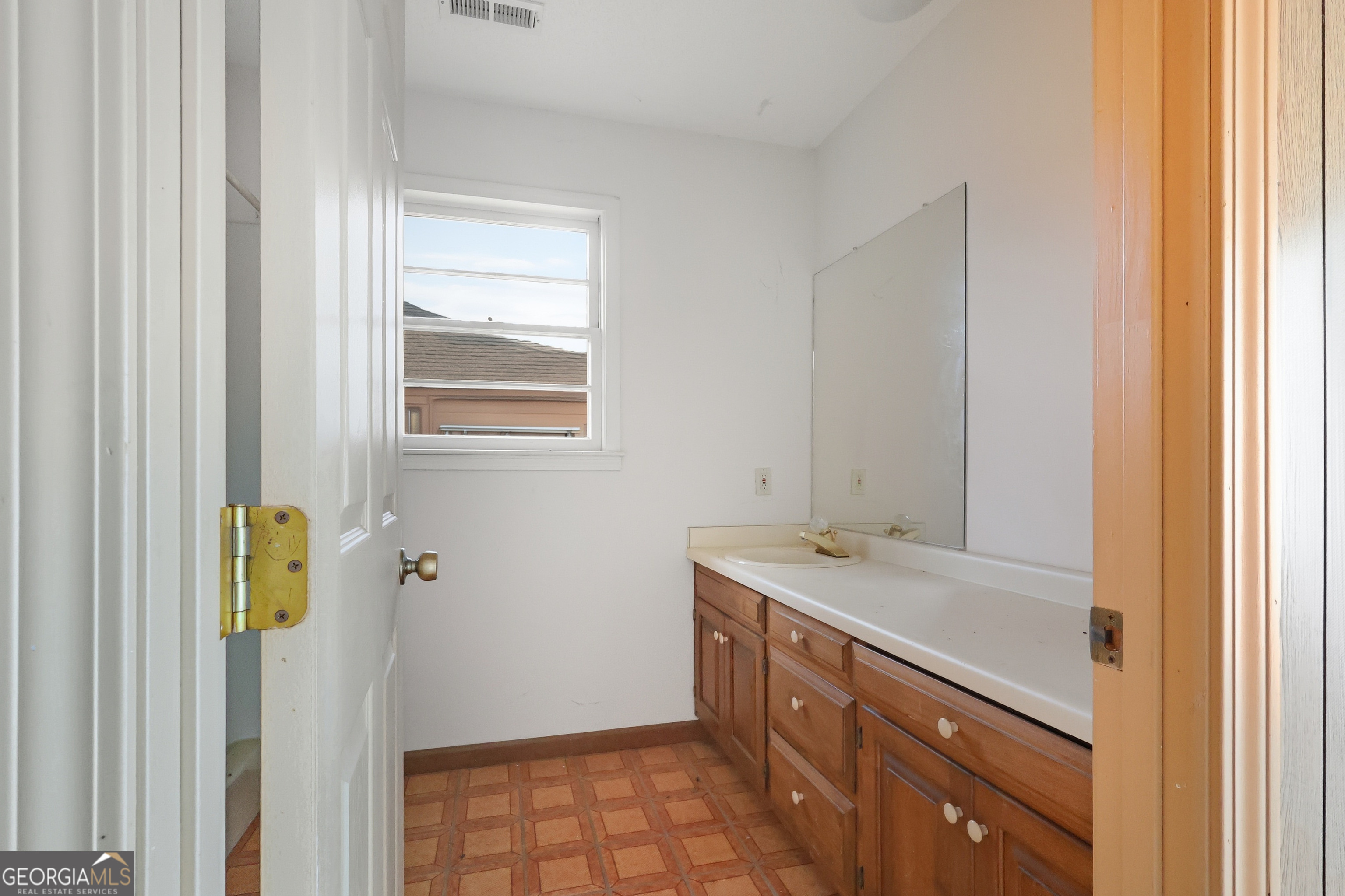 41 Brooks Street Royston, GA 30662 - Photo 43 of 44 a bathroom with a sink and a mirror