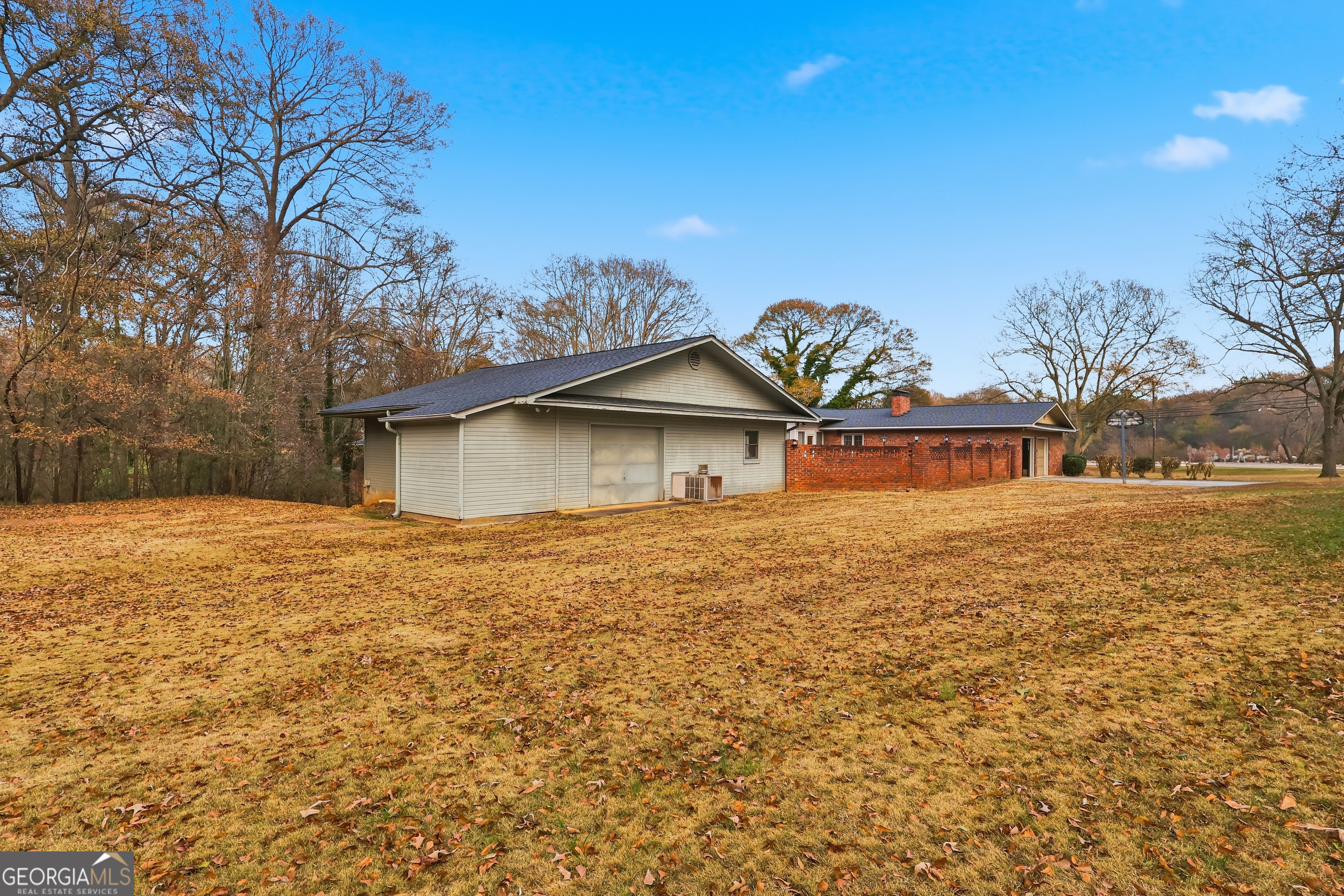 41 Brooks Street Royston, GA 30662 - Photo 5 of 44 a backyard of a house with lots of green space