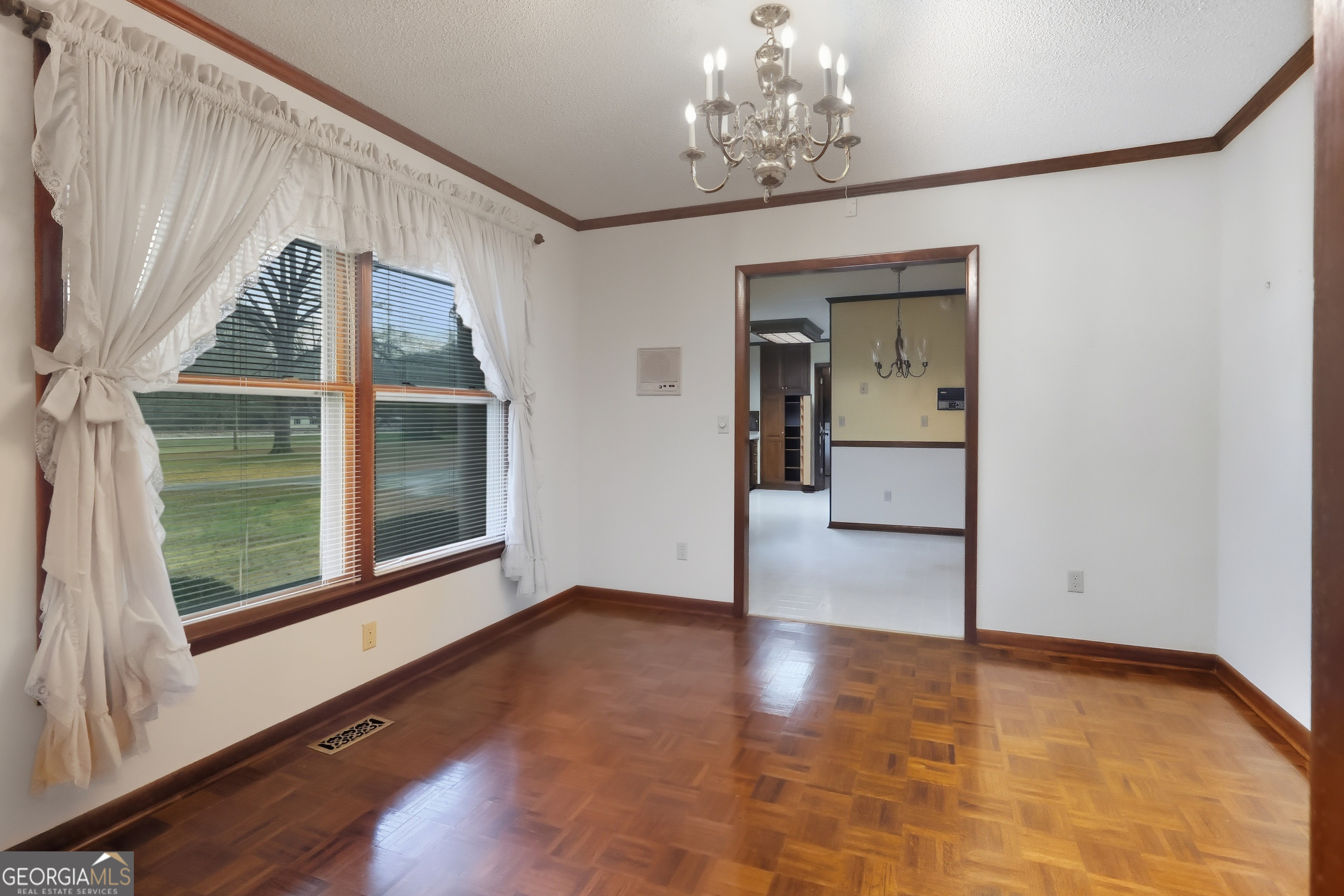 41 Brooks Street Royston, GA 30662 - Photo 6 of 44 a view of an empty room with a window