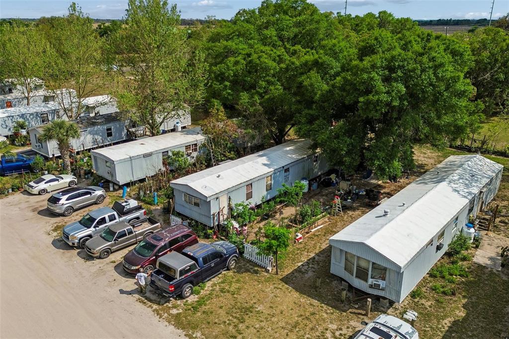 610 Railroad Street Wimauma, FL 33598 - Photo 14 of 34 an aerial view of a house with garden space and street view