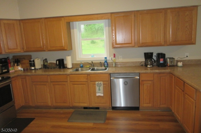 28 Beaver Run Road Lafayette, NJ 07848 - Photo 32 of 36 a kitchen with stainless steel appliances granite countertop a sink stove and cabinets