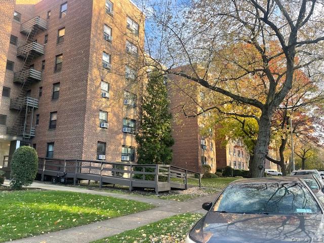 73-45 210th Street, Unit 1C Queens, NY 11364 - Photo 2 of 8 a view of a park with large trees