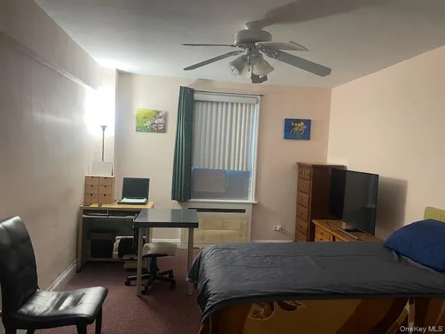 a bedroom with a workspace