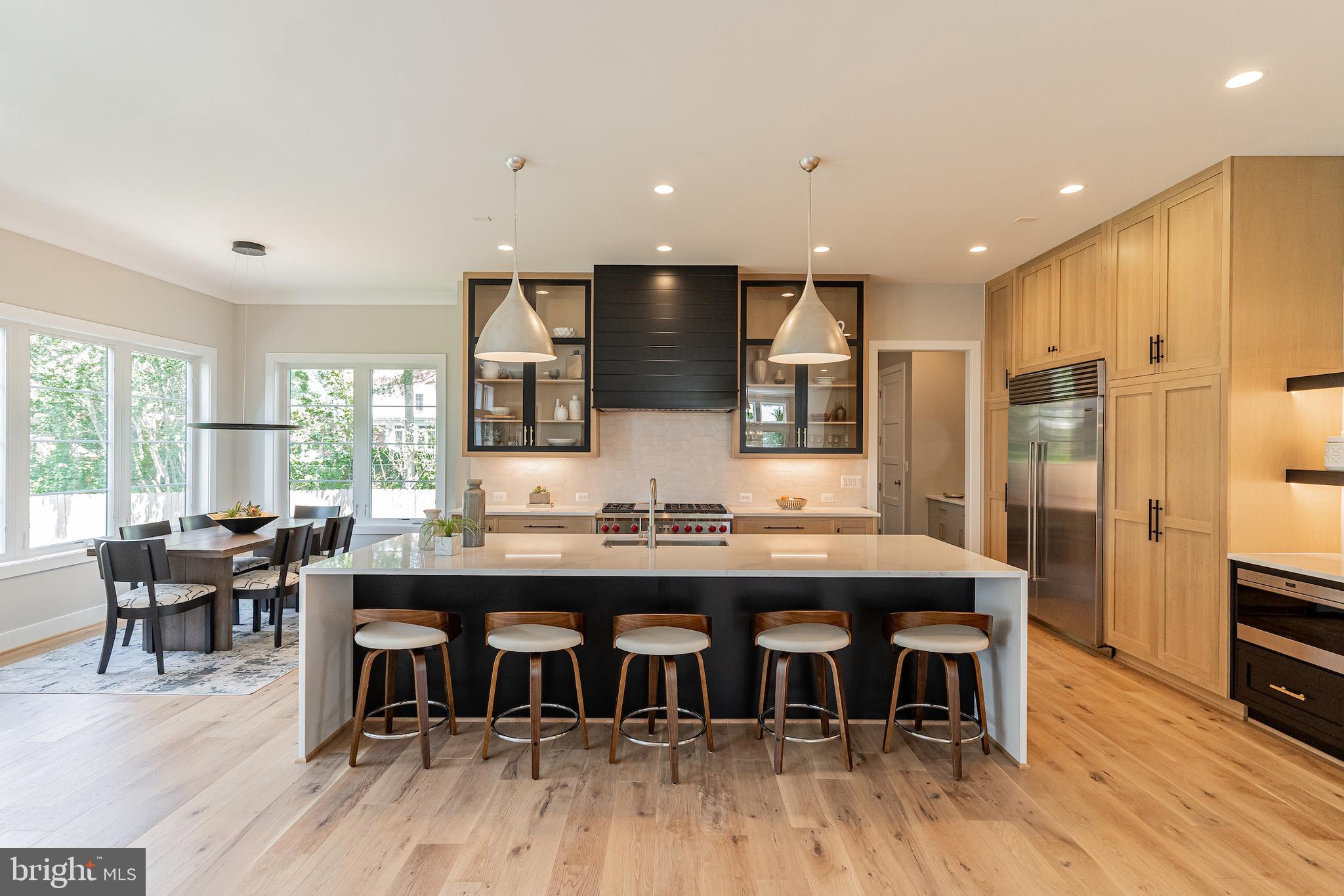 7205 Bayside Court McLean, VA 22101 - Photo 11 of 21 a large kitchen with a table and chairs