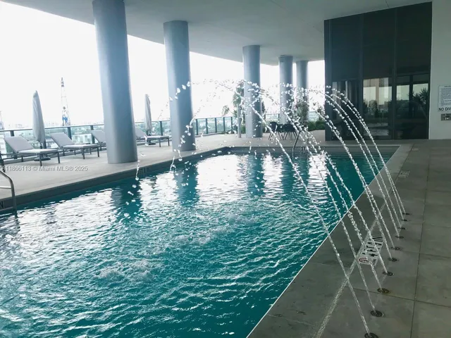 a view of swimming pool from a balcony