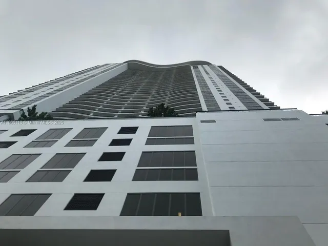 a view of a large building with a black and white checkered floor