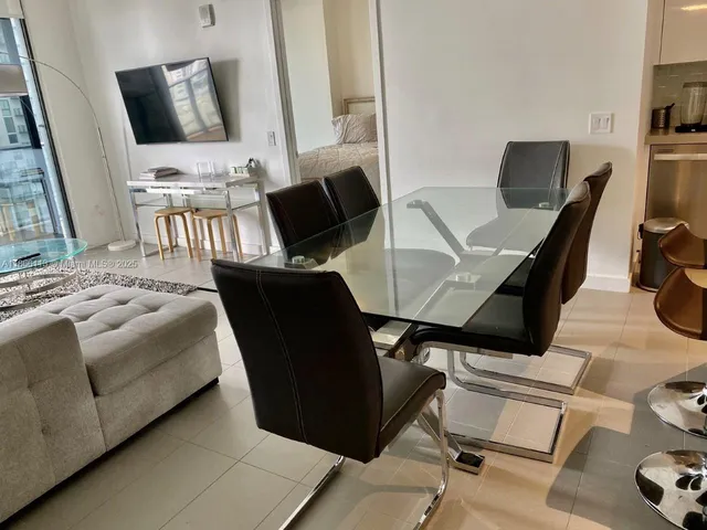 a bed room with a bed and a television