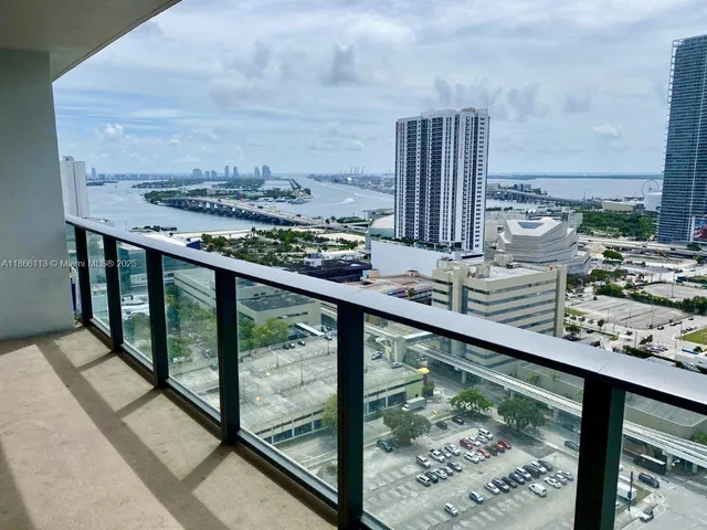 a view of balcony with wooden floor