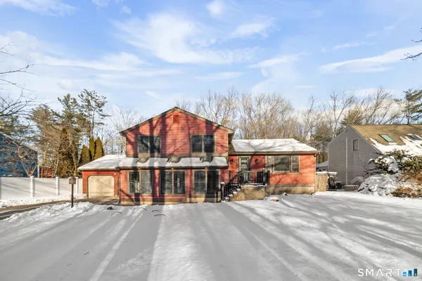 a view of a large building in front of a house