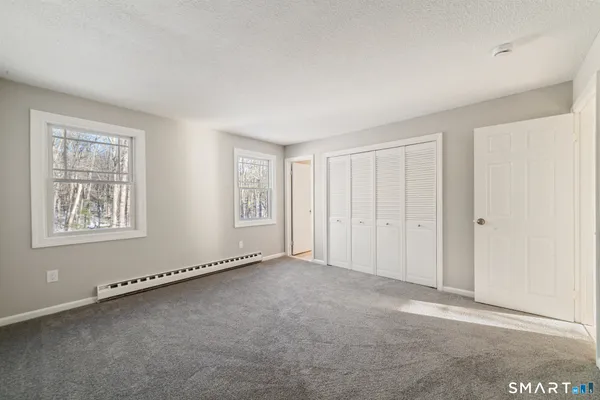 a view of an empty room and glass door