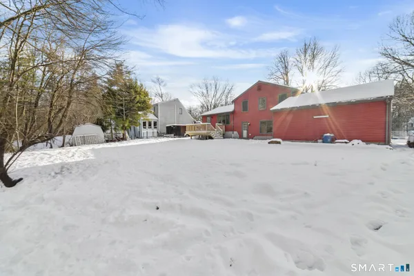 a view of a house with a snow in the yard