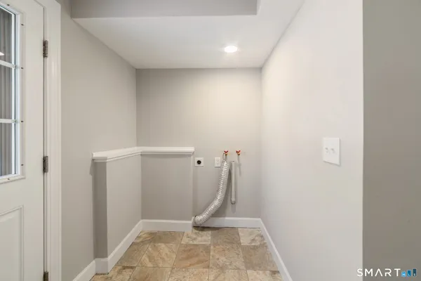 a view of a kitchen with a sink and dishwasher a refrigerator a sink