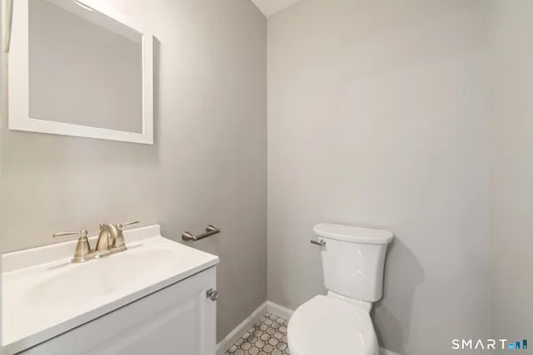 a kitchen with a white cabinets and white stainless steel appliances