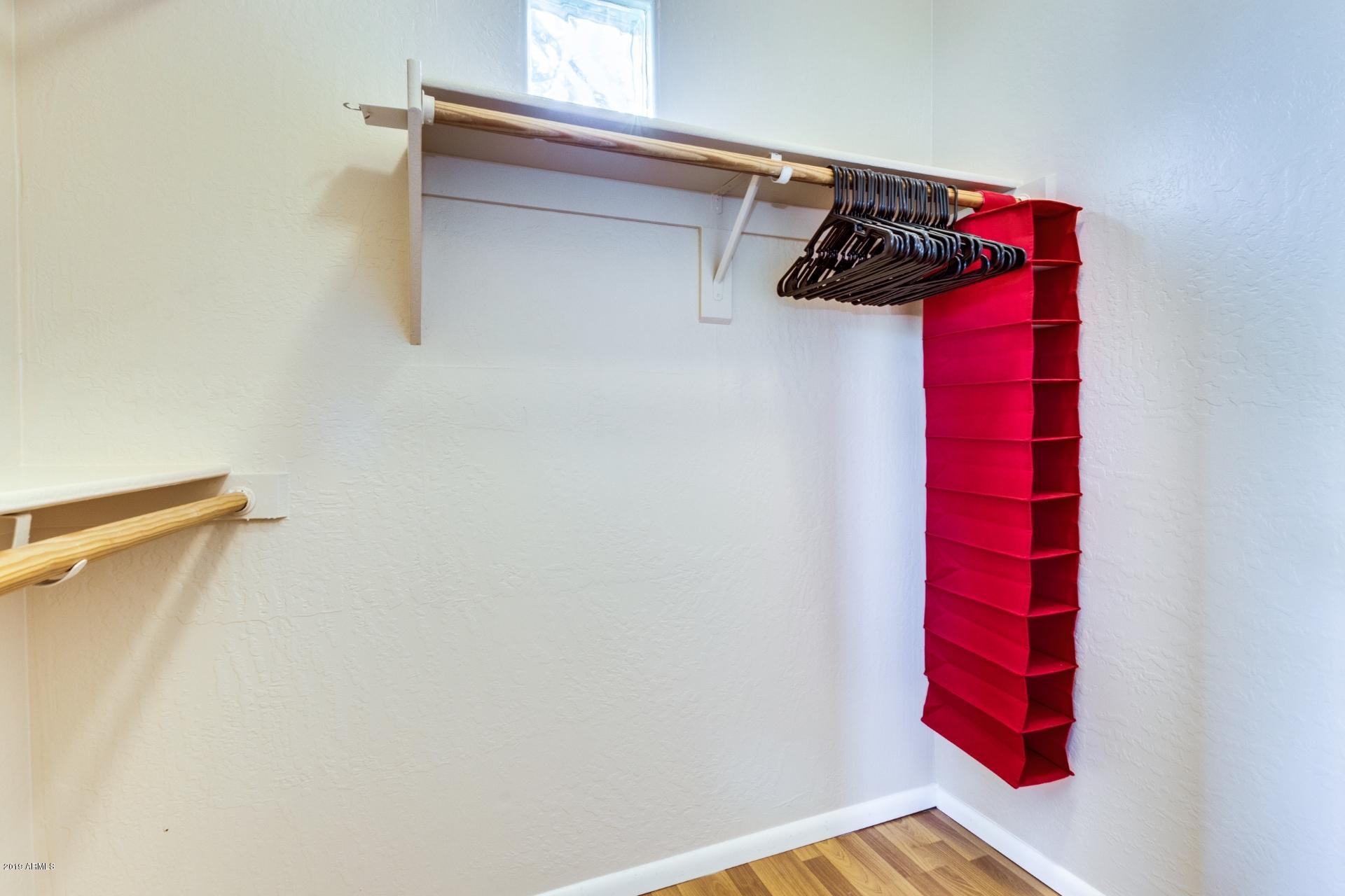 11260 North 92nd Street, Unit 1127 Scottsdale, AZ 85260 - Photo 15 of 42 Master closet 1 of 2