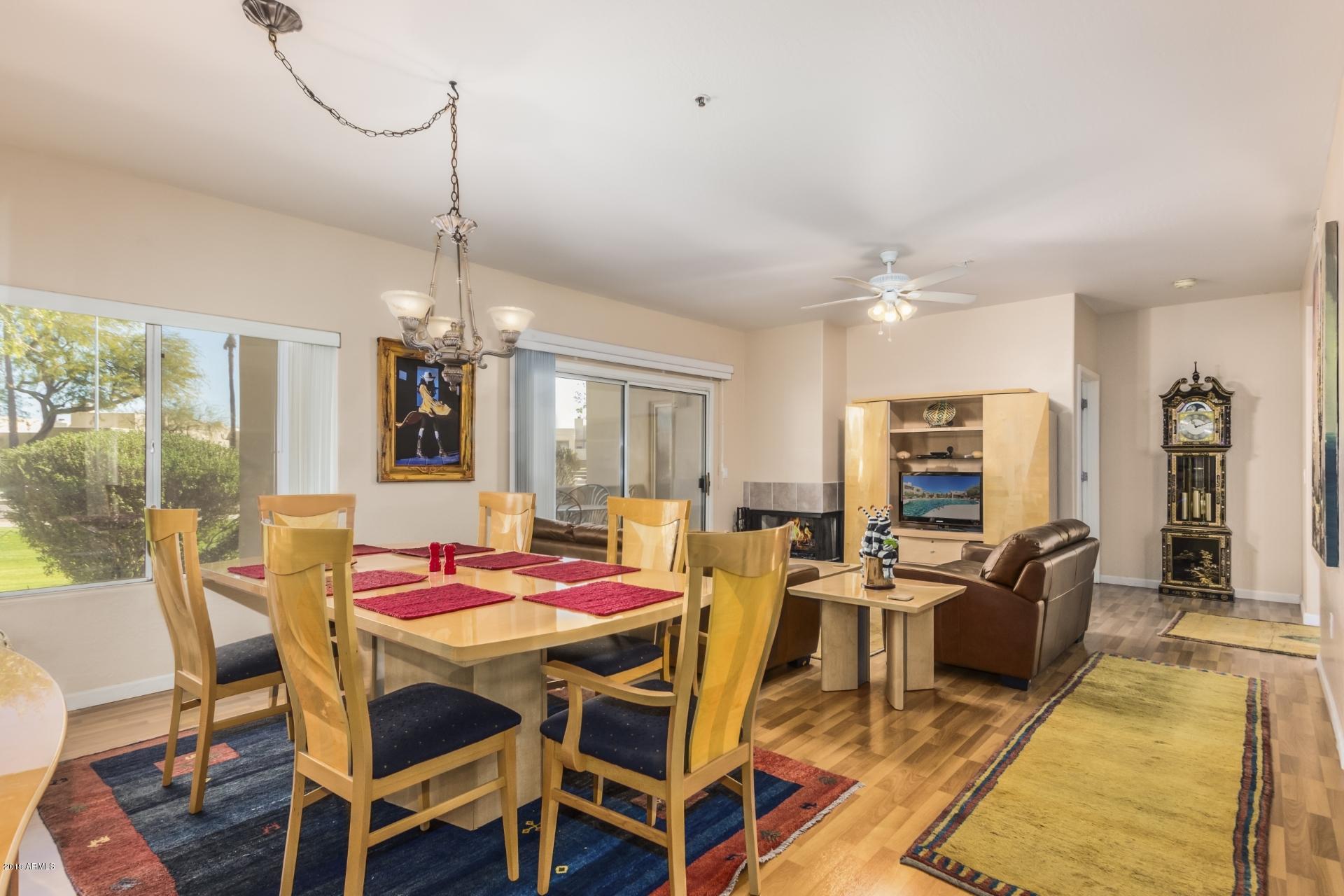 11260 North 92nd Street, Unit 1127 Scottsdale, AZ 85260 - Photo 22 of 42 a view of a dining room with furniture