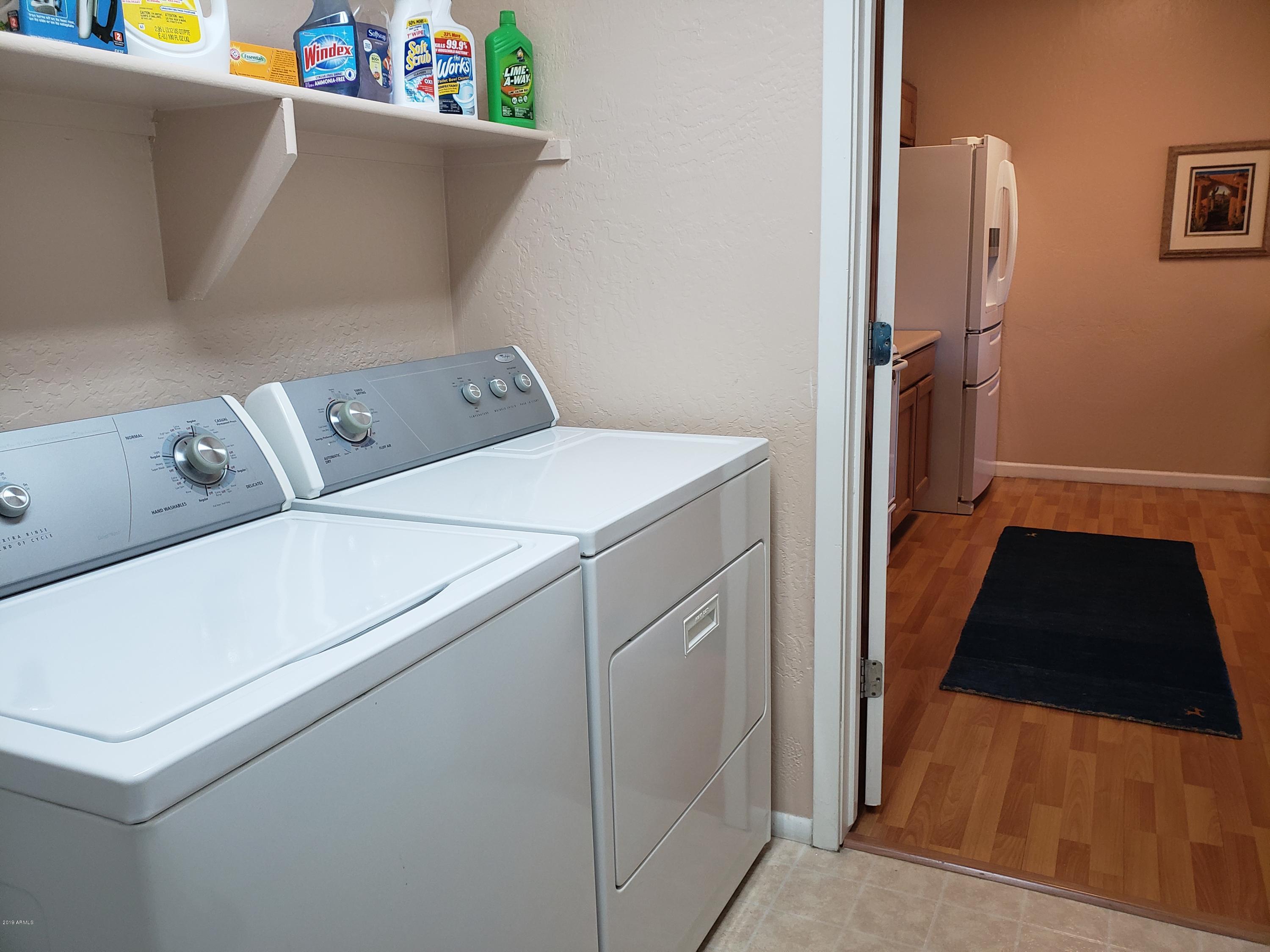11260 North 92nd Street, Unit 1127 Scottsdale, AZ 85260 - Photo 9 of 42 a utility room with dryer and washer