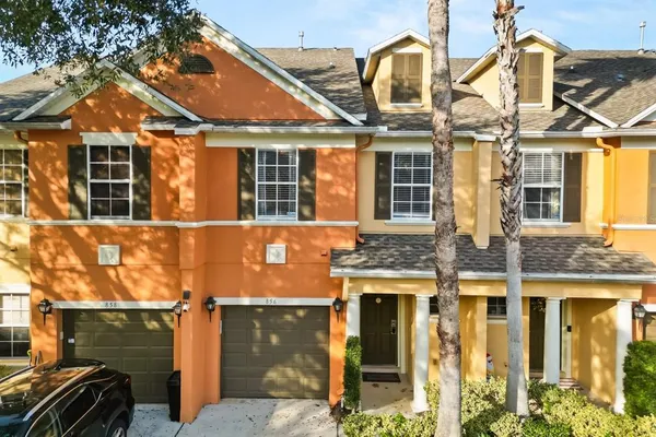 front view of a brick house with a large windows