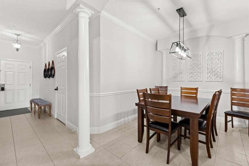 856 Assembly Court Reunion, FL 34747 - Photo 12 of 37 a view of a dining room with furniture and wooden floor