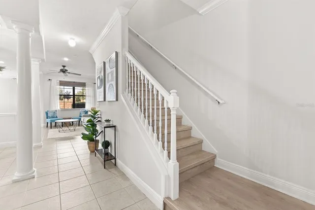 a bedroom with a bed dresser and wooden floor