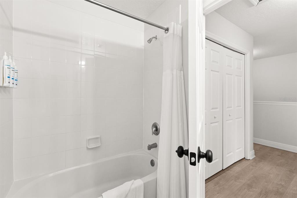 856 Assembly Court Reunion, FL 34747 - Photo 19 of 37 a bathroom with a bathtub