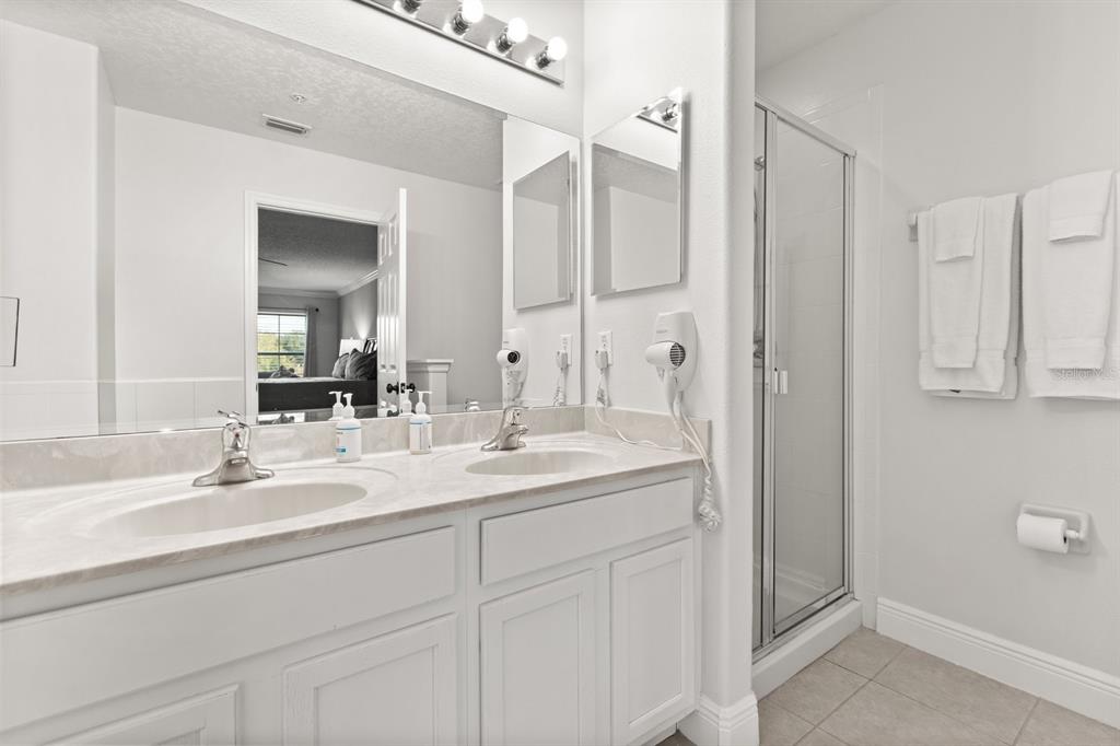 856 Assembly Court Reunion, FL 34747 - Photo 22 of 37 a bathroom with a sink and a mirror