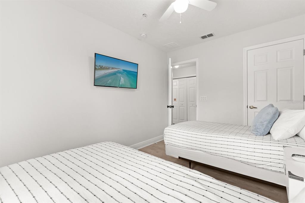 856 Assembly Court Reunion, FL 34747 - Photo 23 of 37 a bedroom with a bed and a painting on the wall