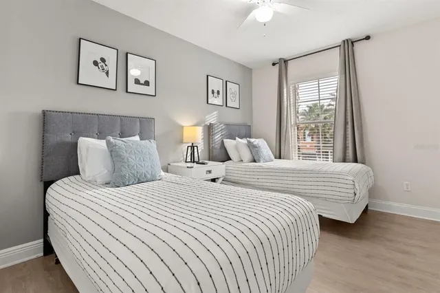 a bedroom with bed and a window