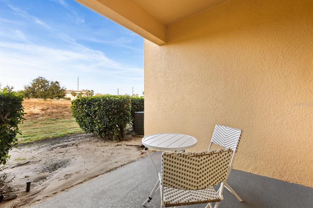 856 Assembly Court Reunion, FL 34747 - Photo 28 of 37 a view of a chair and table in the patio