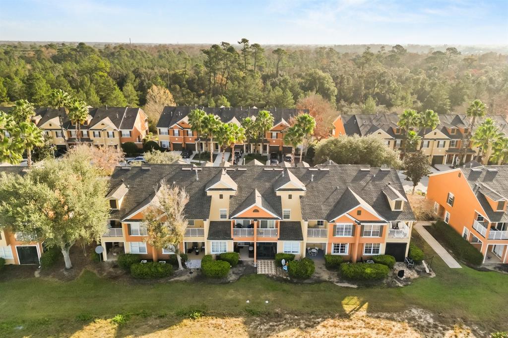 856 Assembly Court Reunion, FL 34747 - Photo 31 of 37 an aerial view of residential houses with city view