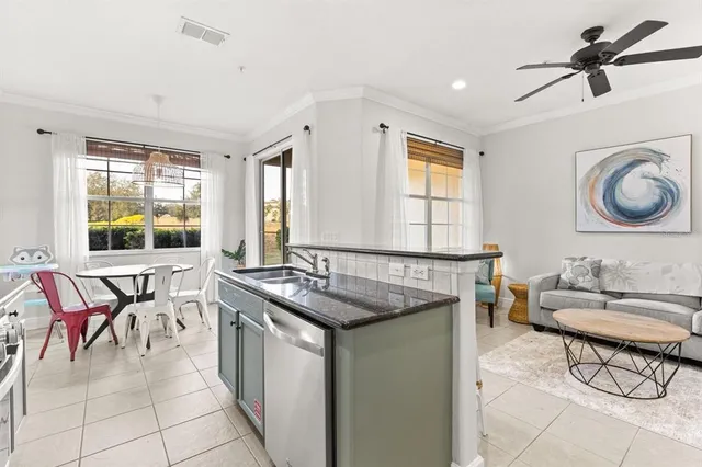 a kitchen with a stove a sink and a refrigerator