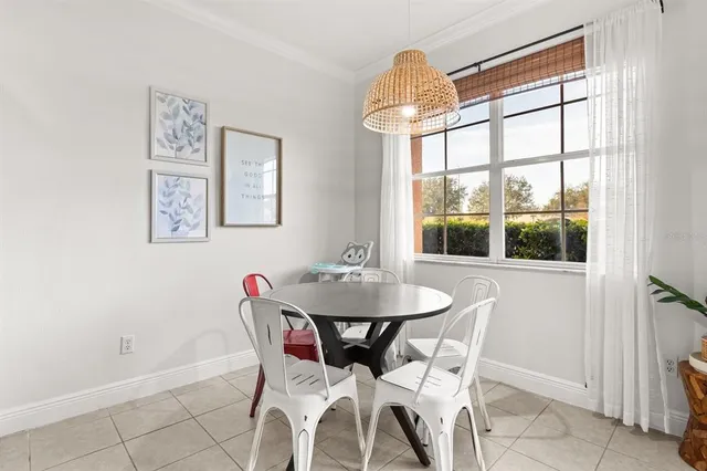 a view of a dining room with furniture and window
