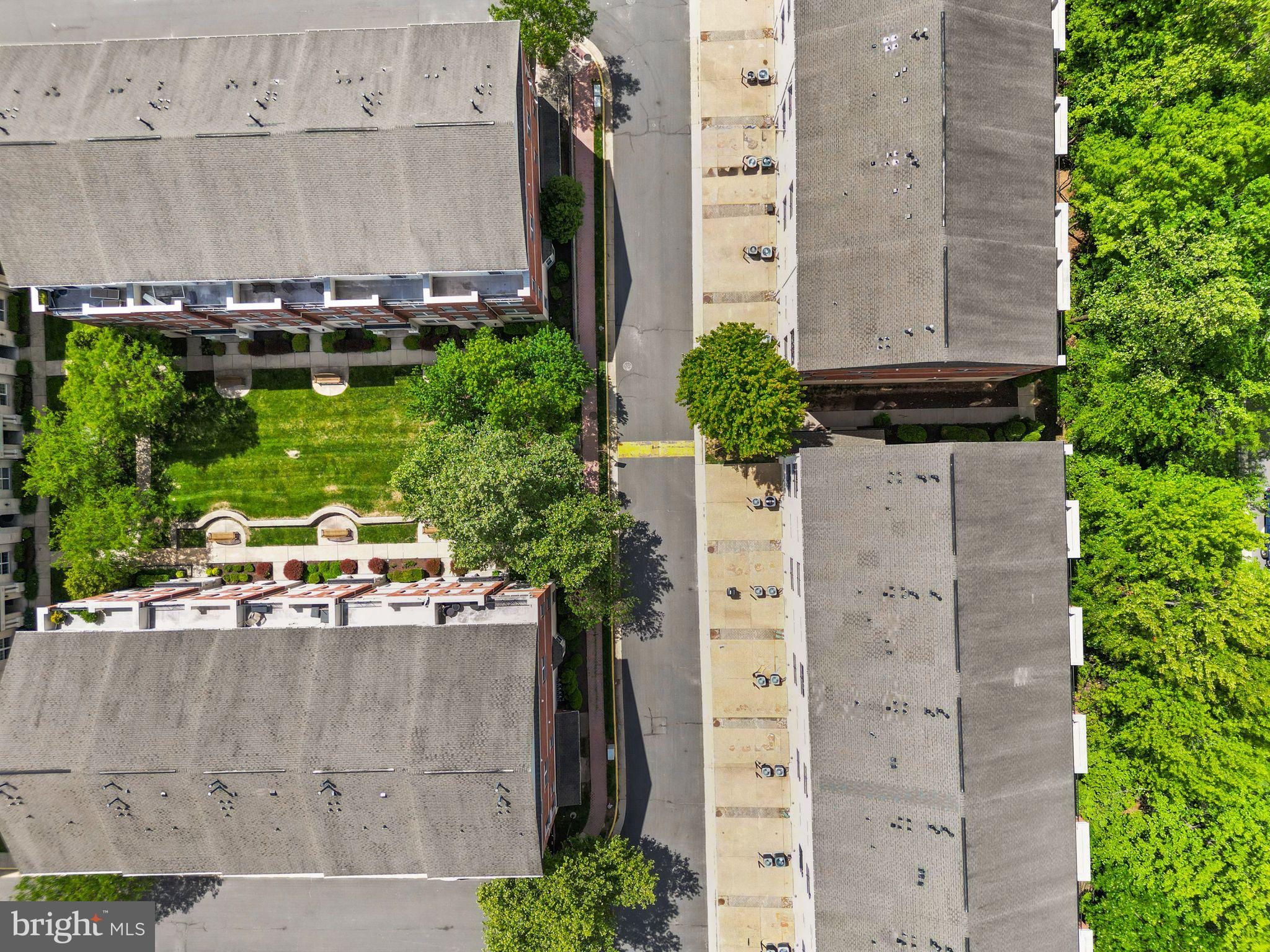 12414 A Liberty Bridge Road Fairfax, VA 22033 - Photo 32 of 38 an aerial view of a residential apartment building with a yard