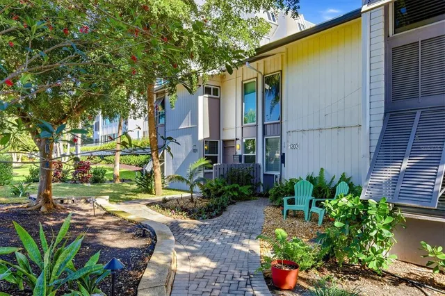 a view of backyard with patio
