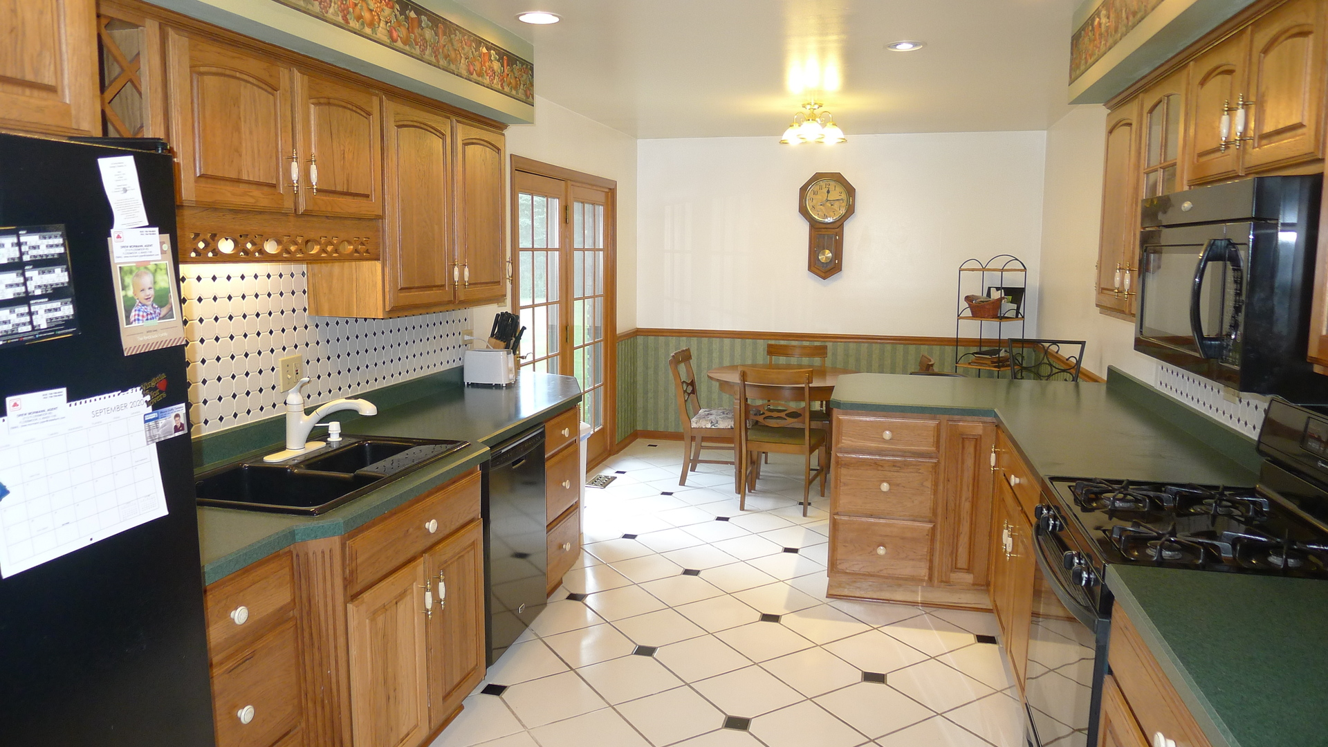 1417 Lawrence Crescent Flossmoor, IL 60422 - Photo 2 of 24 a kitchen with stainless steel appliances granite countertop a stove and a sink