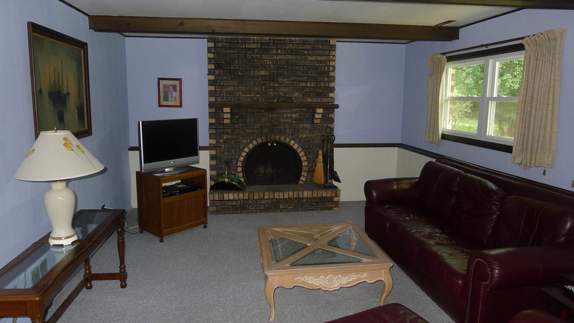 1417 Lawrence Crescent Flossmoor, IL 60422 - Photo 14 of 24 a living room with furniture a flat screen tv and a fireplace