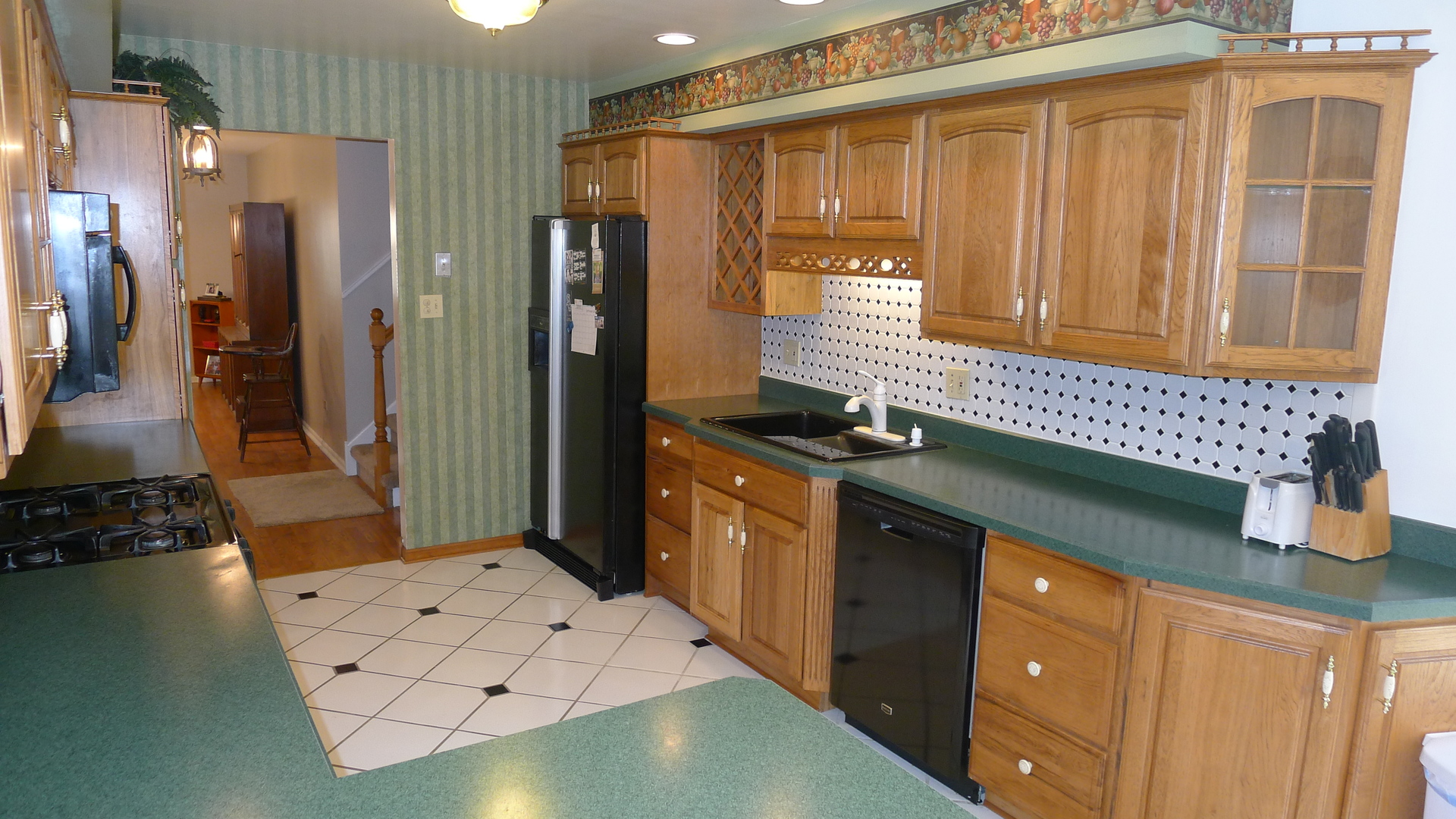 1417 Lawrence Crescent Flossmoor, IL 60422 - Photo 3 of 24 a kitchen with stainless steel appliances granite countertop a stove a sink and a refrigerator