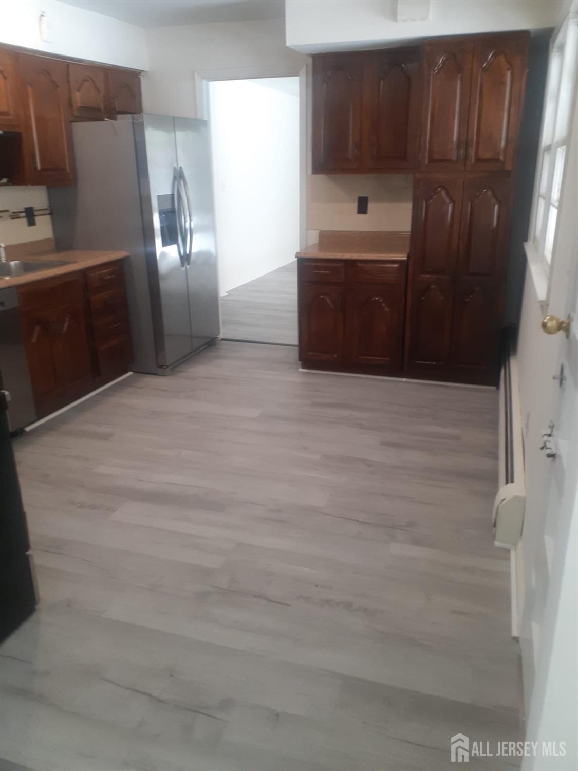 1776 Oak Tree Road Edison, NJ 08820 - Photo 2 of 9 a view of cabinets and wooden floor