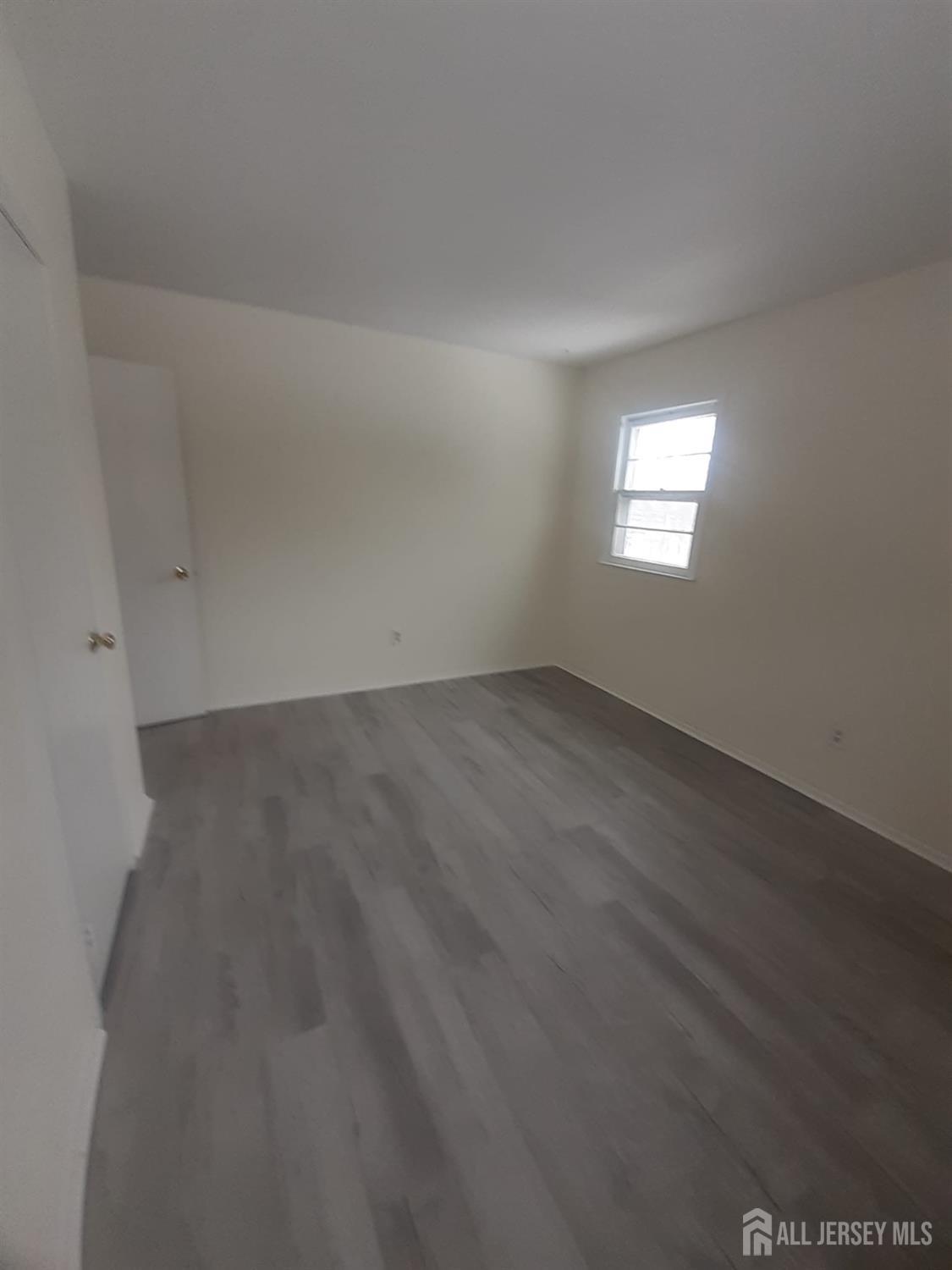 1776 Oak Tree Road Edison, NJ 08820 - Photo 3 of 9 an empty room with a window