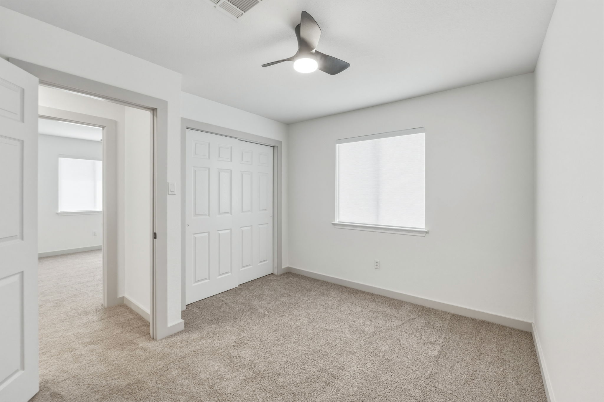 211 Banner Avenue Leander, TX 78641 - Photo 17 of 27 an empty room with windows and fan